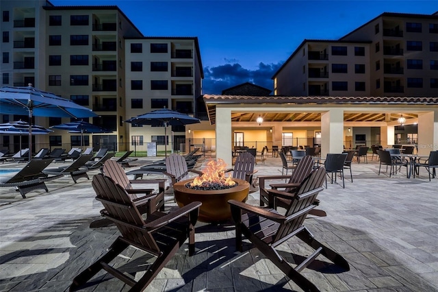 patio terrace at dusk with an outdoor fire pit