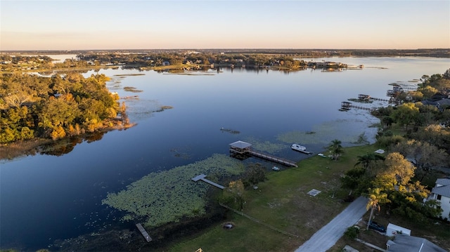 aerial view at dusk with a water view