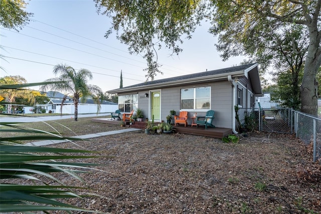 view of front of home featuring a wooden deck