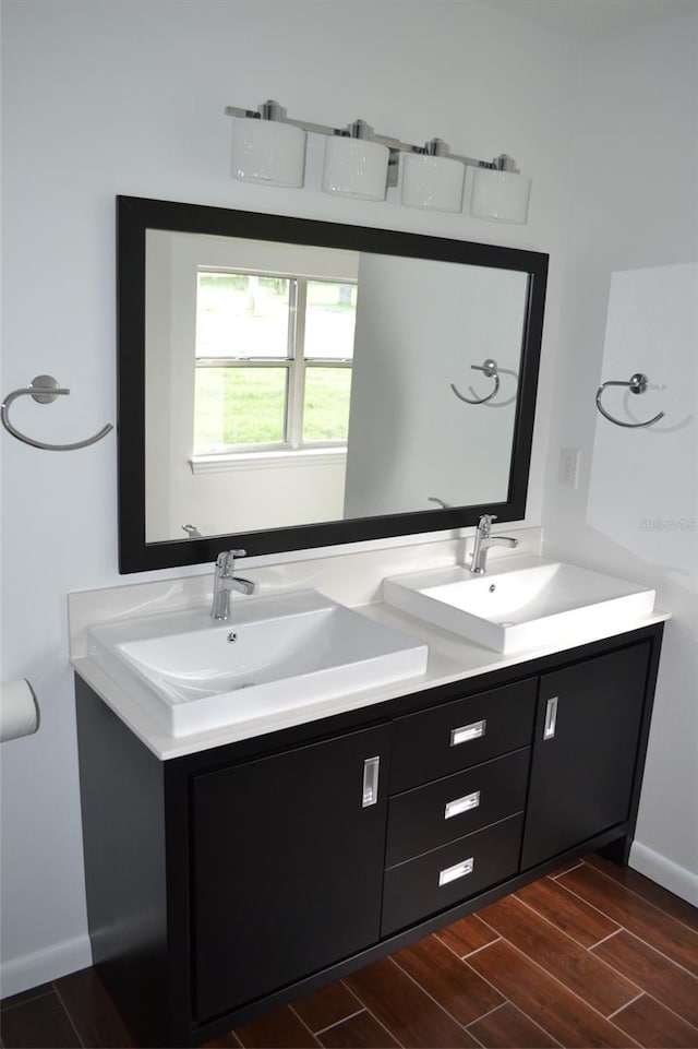 bathroom with hardwood / wood-style flooring and vanity