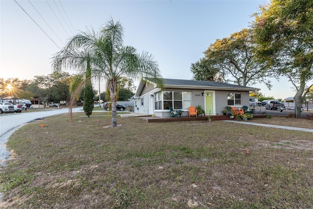 ranch-style home with a front yard