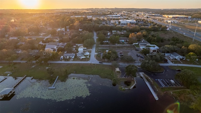 aerial view at dusk with a water view