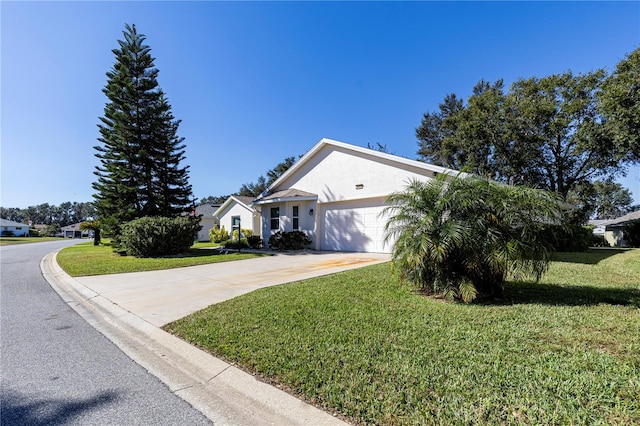 ranch-style home with a front yard and a garage