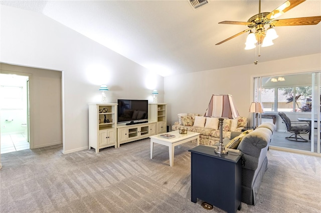 carpeted living room featuring ceiling fan and lofted ceiling