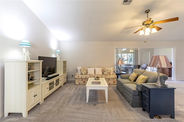 living room with ceiling fan, carpet, and vaulted ceiling