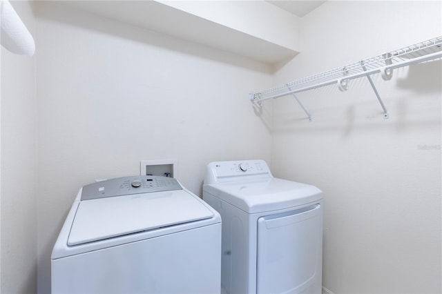 laundry area featuring independent washer and dryer