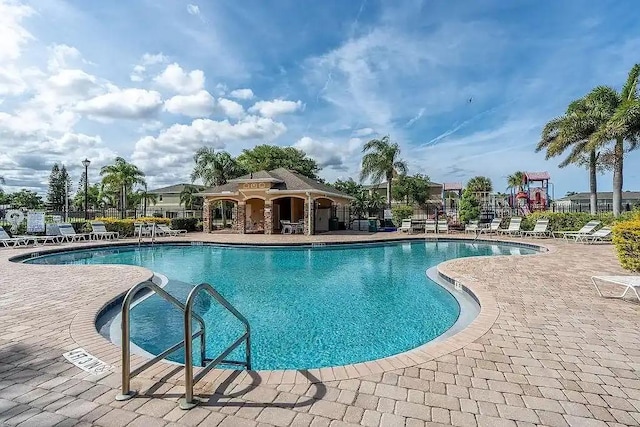 view of swimming pool featuring a patio area