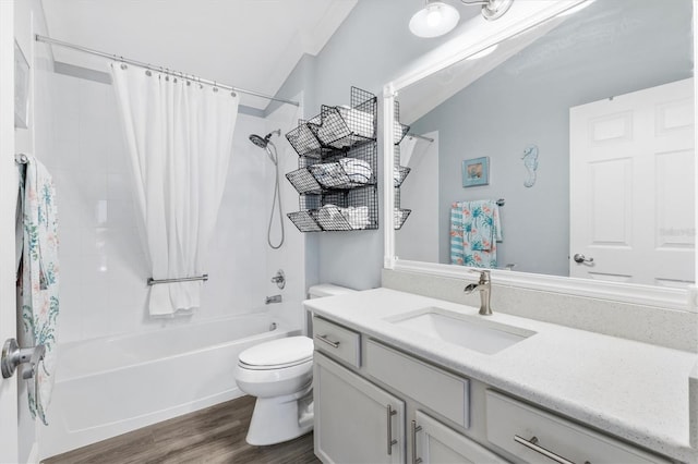 full bathroom featuring shower / bath combo, vanity, hardwood / wood-style flooring, and toilet