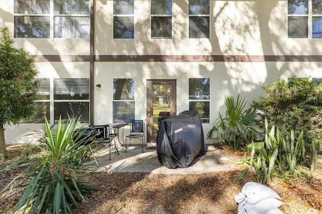 back of property with a patio