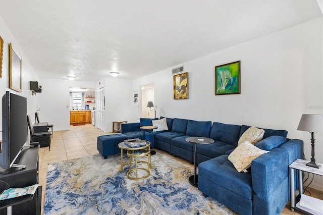 living room with light tile patterned flooring