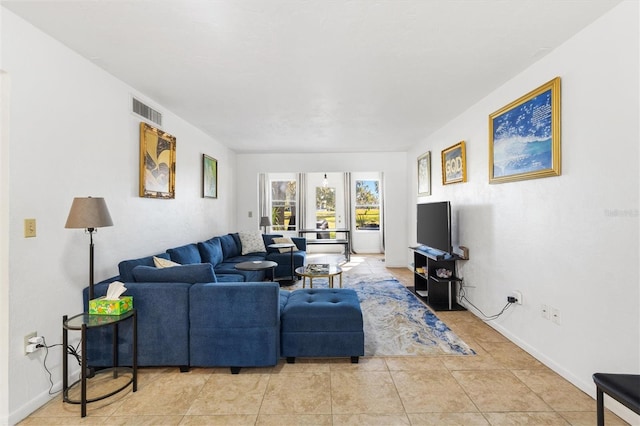 living room with light tile patterned flooring