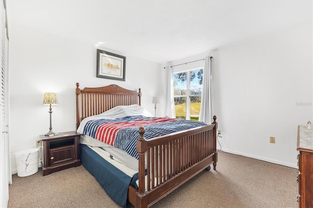 bedroom featuring light carpet