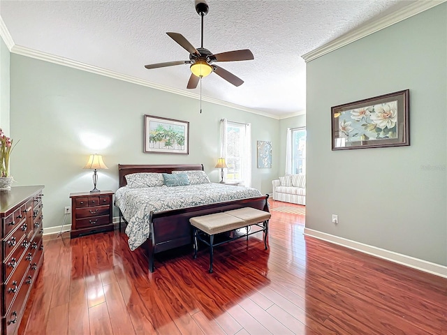 bedroom featuring ceiling fan, dark hardwood / wood-style flooring, a textured ceiling, and ornamental molding