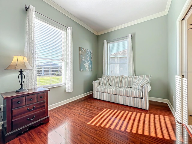 sitting room featuring wood-type flooring and crown molding