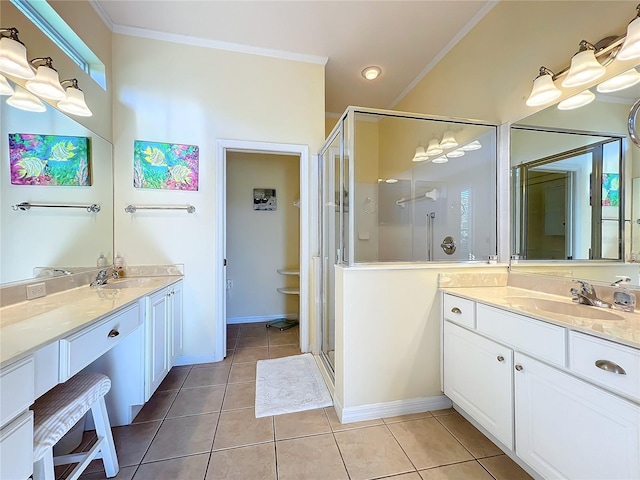 bathroom featuring tile patterned floors, a shower with door, and crown molding