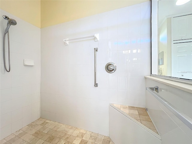 bathroom with a tile shower