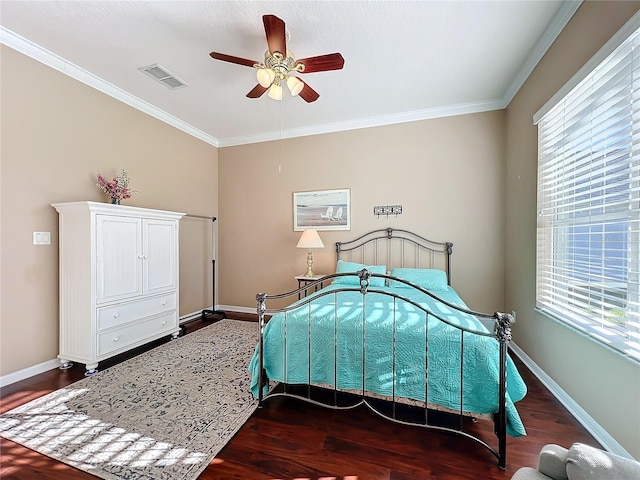 bedroom featuring ceiling fan, dark hardwood / wood-style flooring, and multiple windows