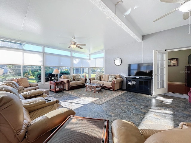 living room featuring ceiling fan and french doors