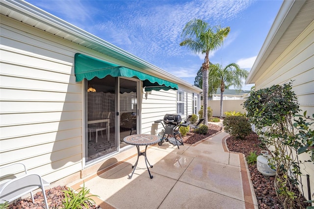 view of patio featuring a grill