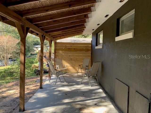 view of patio featuring fence