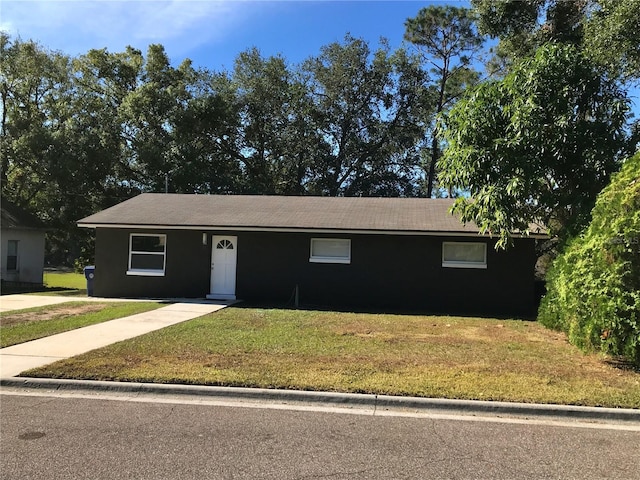 ranch-style house with a front yard