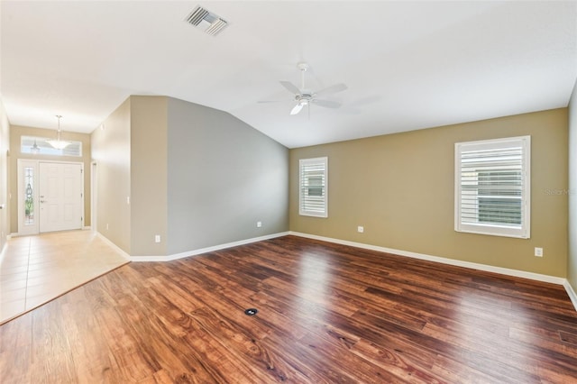 spare room with hardwood / wood-style flooring, ceiling fan, and lofted ceiling