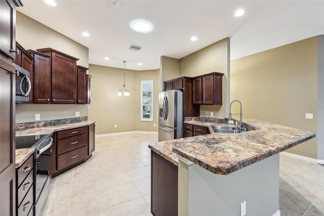 kitchen featuring sink, stainless steel appliances, light stone counters, a notable chandelier, and decorative light fixtures