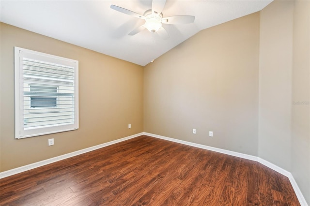 spare room with ceiling fan, dark hardwood / wood-style flooring, and lofted ceiling