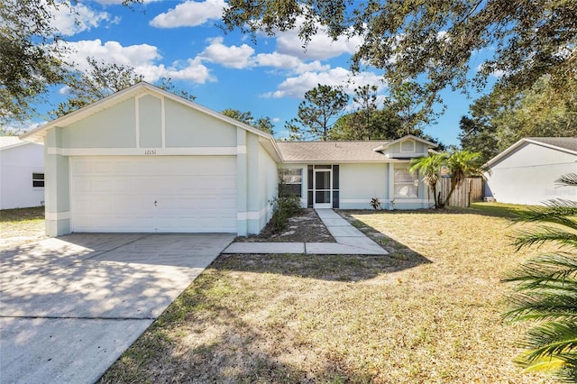 ranch-style house with a front lawn and a garage