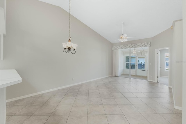 tiled empty room featuring ceiling fan with notable chandelier and high vaulted ceiling