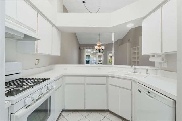 kitchen with white cabinetry, sink, a chandelier, white appliances, and light tile patterned floors