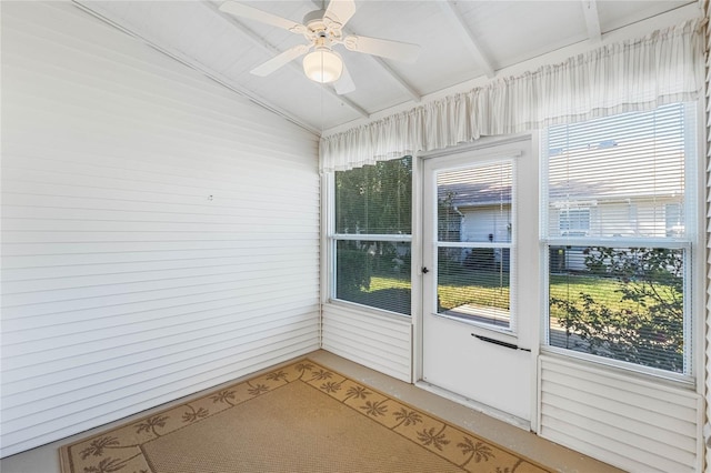 unfurnished sunroom with ceiling fan and lofted ceiling