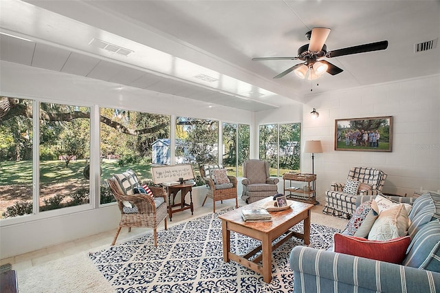 sunroom / solarium featuring ceiling fan