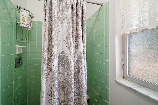 bathroom with a shower with shower curtain