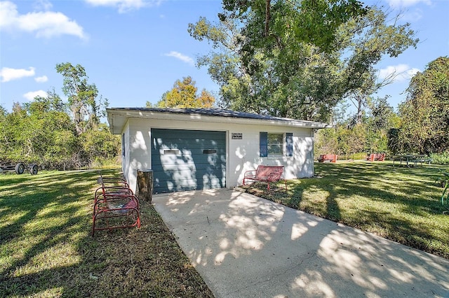 ranch-style house with a garage and a front yard