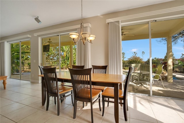 dining room featuring light tile patterned flooring and a notable chandelier