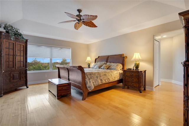 bedroom with ceiling fan and light hardwood / wood-style floors