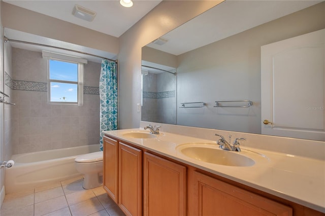 full bathroom featuring tile patterned flooring, vanity, shower / bath combo, and toilet