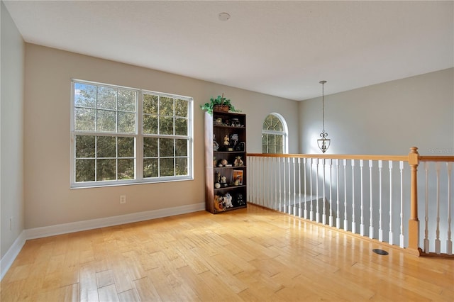 spare room with light hardwood / wood-style flooring