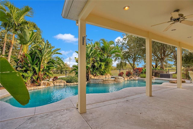 view of pool featuring ceiling fan, an in ground hot tub, and a patio