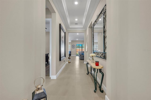 hallway featuring light tile patterned flooring and ornamental molding