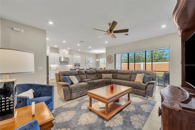 tiled living room with ceiling fan