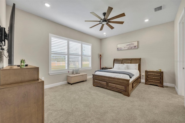 bedroom featuring light colored carpet and ceiling fan