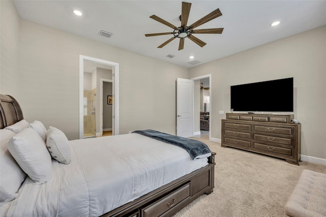 bedroom featuring connected bathroom, light colored carpet, and ceiling fan