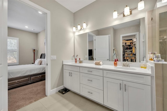 bathroom featuring tile patterned flooring and vanity