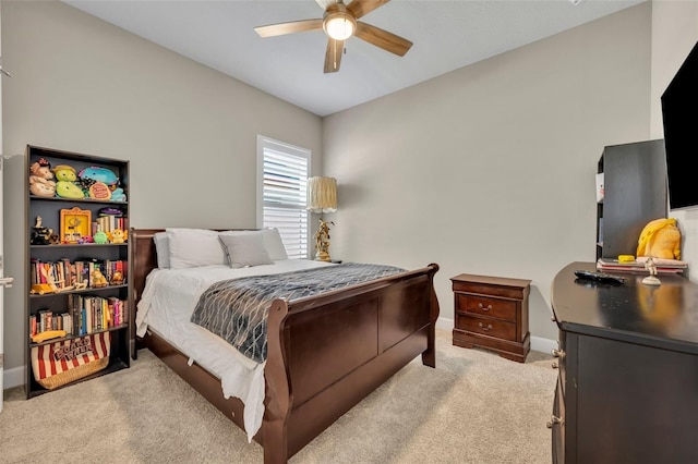 bedroom with ceiling fan and light colored carpet