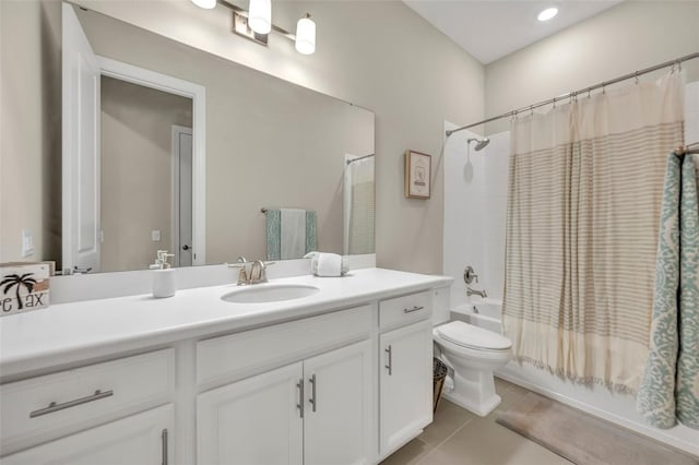 full bathroom with tile patterned floors, vanity, toilet, and shower / tub combo