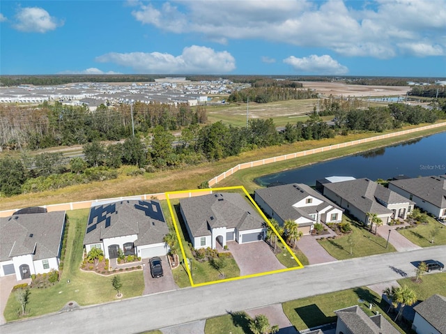 drone / aerial view with a water view