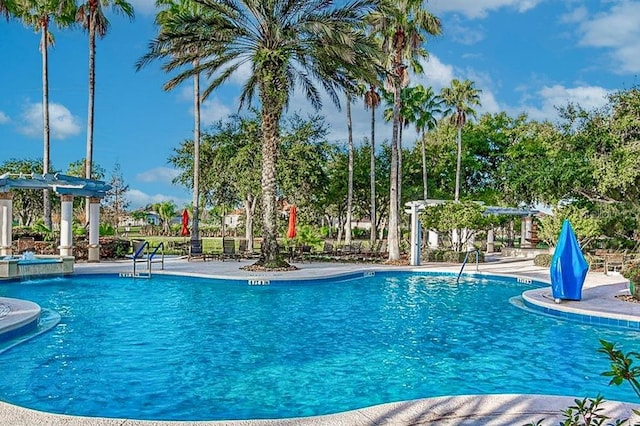 view of pool with pool water feature