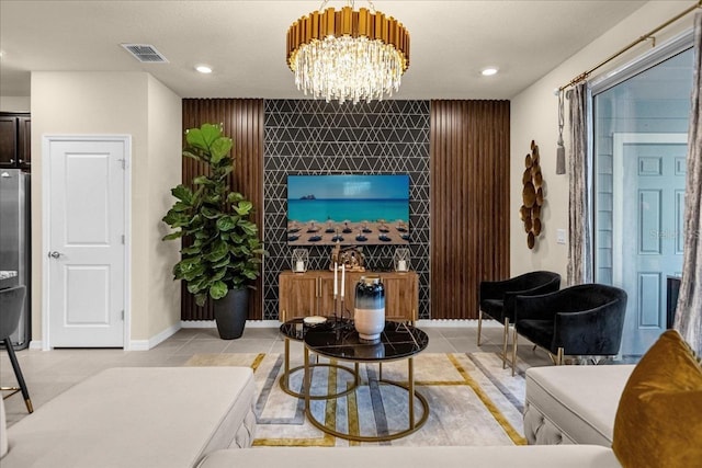 living room featuring light tile patterned floors and an inviting chandelier